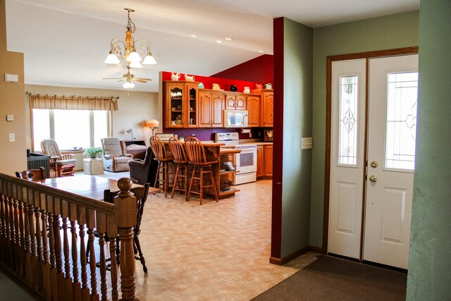 46377 Sunset Ct, Morris, MN 56267 - entrance foyer with a notable chandelier and vaulted ceiling