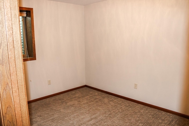 46377 Sunset Ct, Morris, MN 56267 - empty room with dark carpet and baseboards