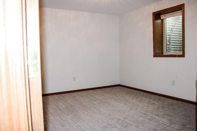 46377 Sunset Ct, Morris, MN 56267 - unfurnished room with baseboards and carpet floors