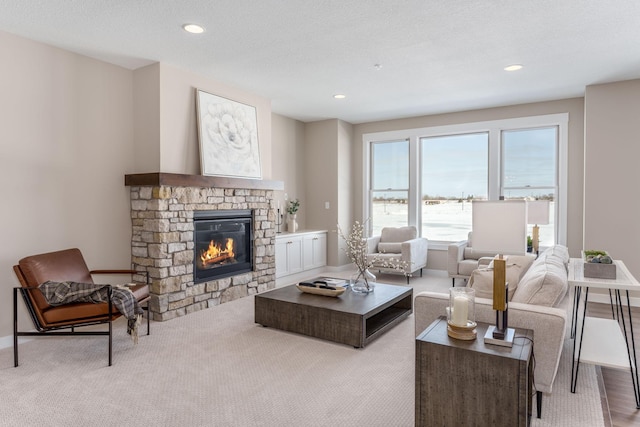 2315 Simply Living Ln Unit C, Hudson, WI 54016 - carpeted living room with a stone fireplace and recessed lighting