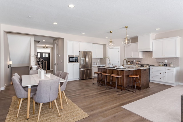 2315 Simply Living Ln Unit C, Hudson, WI 54016 - dining space featuring wood finished floors and recessed lighting