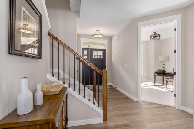 2315 Simply Living Ln Unit C, Hudson, WI 54016 - foyer entrance with wood finished floors and stairway