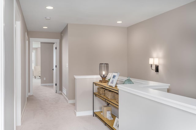 2315 Simply Living Ln Unit C, Hudson, WI 54016 - hallway featuring light colored carpet, recessed lighting, and an upstairs landing