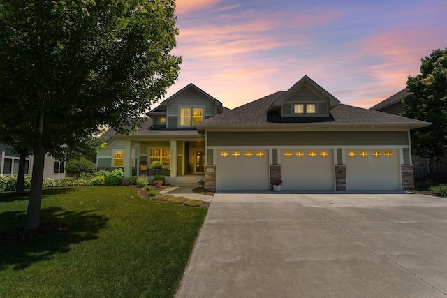 8871 Kahl Way NE, Otsego, MN 55362 - view of front of house with a garage, a front lawn, driveway, a porch, and roof with shingles
