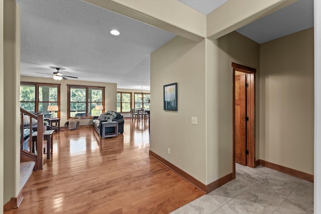 8871 Kahl Way NE, Otsego, MN 55362 - hallway with a textured ceiling and light wood finished floors