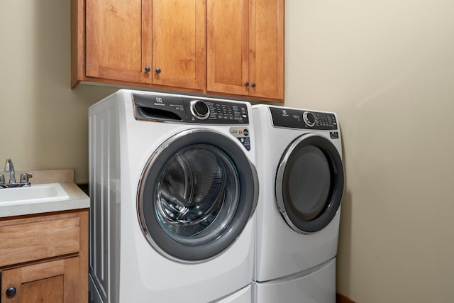 8871 Kahl Way NE, Otsego, MN 55362 - laundry room featuring washing machine and dryer and cabinet space