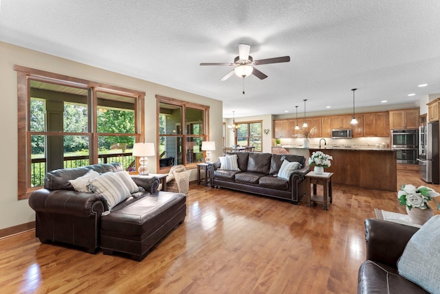 8871 Kahl Way NE, Otsego, MN 55362 - living area with ceiling fan, light wood finished floors, and recessed lighting