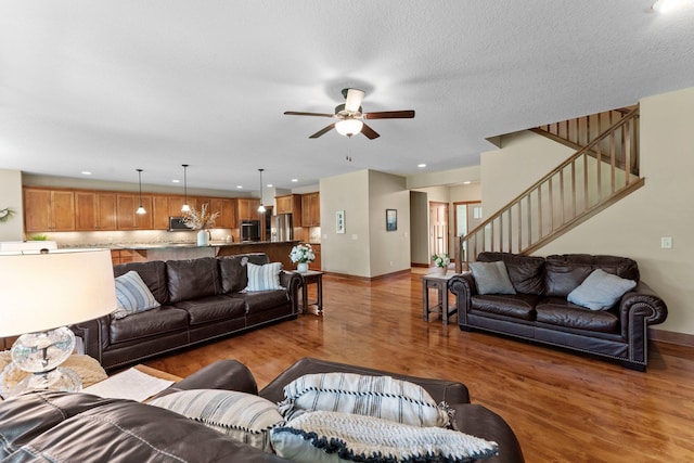 8871 Kahl Way NE, Otsego, MN 55362 - living room featuring ceiling fan, light wood-style floors, stairway, and recessed lighting