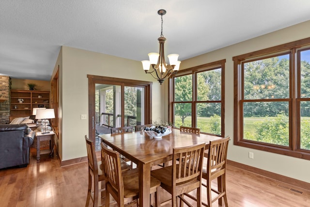 8871 Kahl Way NE, Otsego, MN 55362 - dining area with a chandelier and light wood finished floors