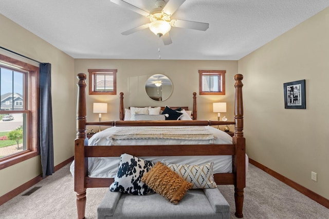 8871 Kahl Way NE, Otsego, MN 55362 - bedroom featuring carpet flooring, multiple windows, and a ceiling fan