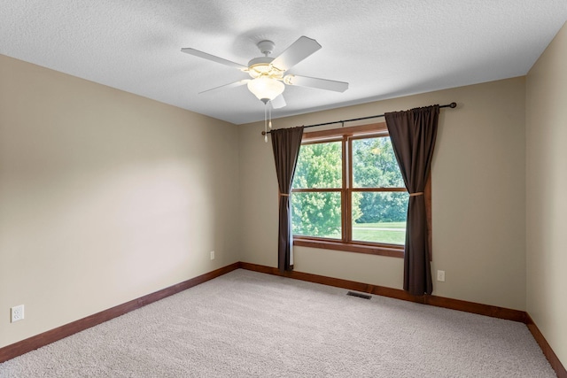 8871 Kahl Way NE, Otsego, MN 55362 - unfurnished room with light carpet, ceiling fan, and a textured ceiling