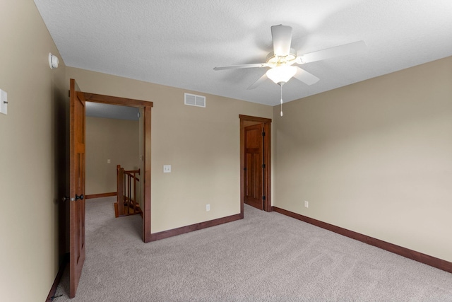 8871 Kahl Way NE, Otsego, MN 55362 - empty room with ceiling fan, light colored carpet, and a smoke detector