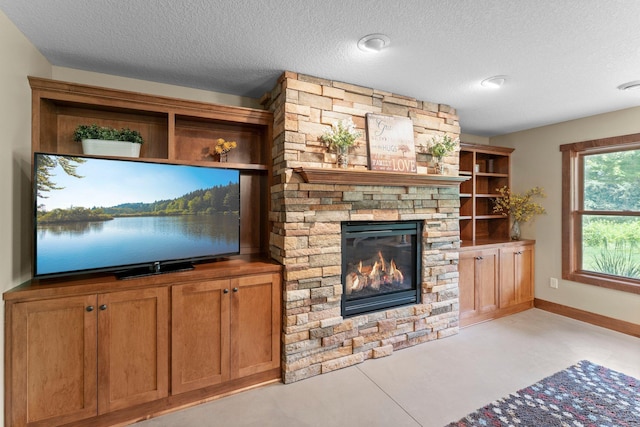 8871 Kahl Way NE, Otsego, MN 55362 - unfurnished living room with a textured ceiling and a fireplace