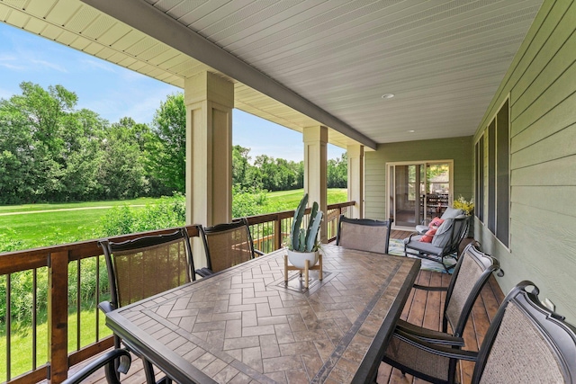 8871 Kahl Way NE, Otsego, MN 55362 - wooden deck with outdoor dining space and view of wooded area