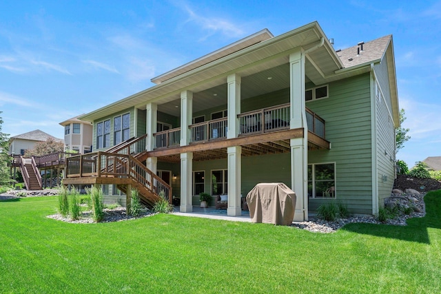 8871 Kahl Way NE, Otsego, MN 55362 - back of property with stairway, a yard, a wooden deck, and a patio area