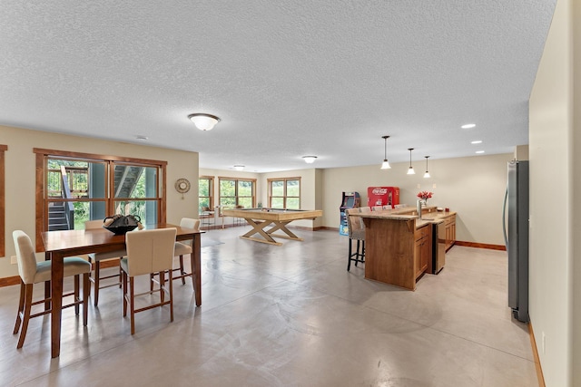 8871 Kahl Way NE, Otsego, MN 55362 - dining room with pool table, a textured ceiling, recessed lighting, and concrete flooring