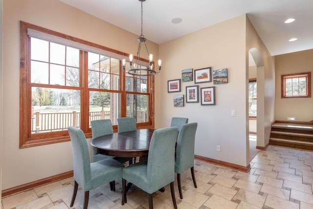 190 Stony Creek Rd, Mankato, MN 56001 - dining room with baseboards, arched walkways, a chandelier, recessed lighting, and stairway