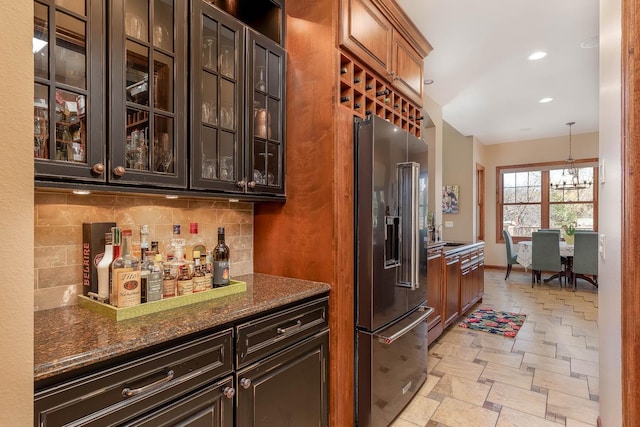190 Stony Creek Rd, Mankato, MN 56001 - indoor dry bar featuring high end fridge, backsplash, light stone finish flooring, recessed lighting, and hanging light fixtures