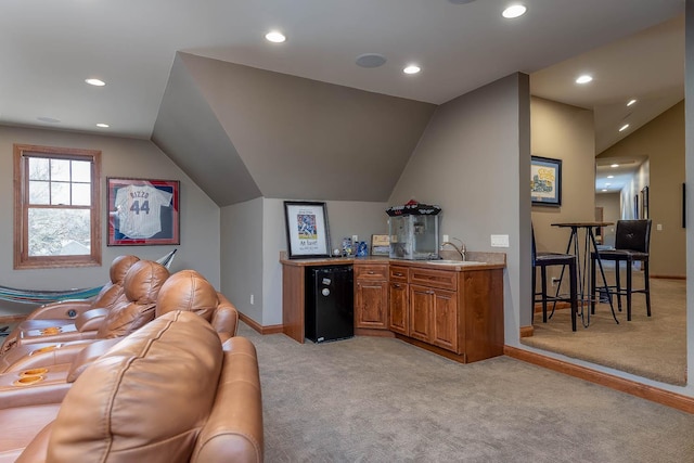 190 Stony Creek Rd, Mankato, MN 56001 - living area with light carpet, recessed lighting, vaulted ceiling, baseboards, and bar