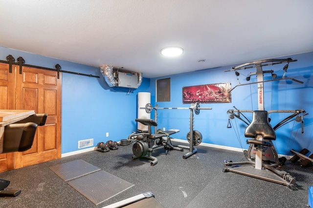 190 Stony Creek Rd, Mankato, MN 56001 - workout room featuring a barn door and baseboards