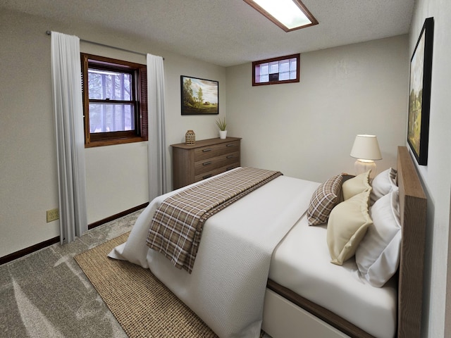 14199 Riverbend Trl, Rocksbury Twp, MN 56701 - carpeted bedroom featuring baseboards and a textured ceiling