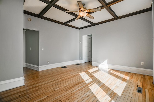 spare room featuring visible vents, baseboards, a ceiling fan, and coffered ceiling