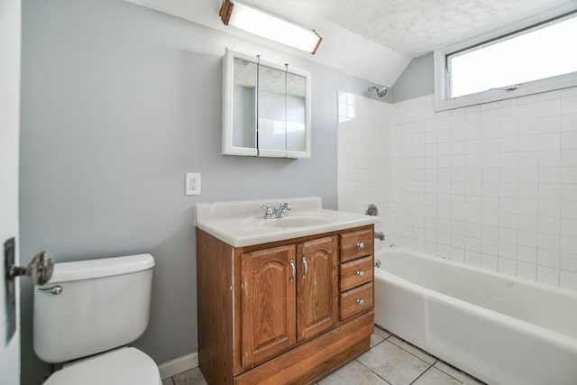 full bath featuring bathing tub / shower combination, vanity, toilet, lofted ceiling, and tile patterned floors