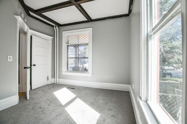 unfurnished bedroom with carpet floors, baseboards, and coffered ceiling