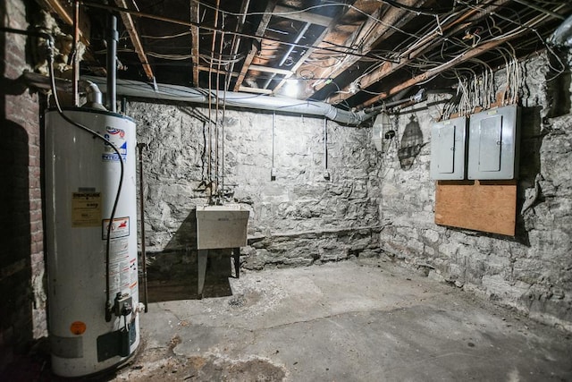 unfinished basement with gas water heater and electric panel