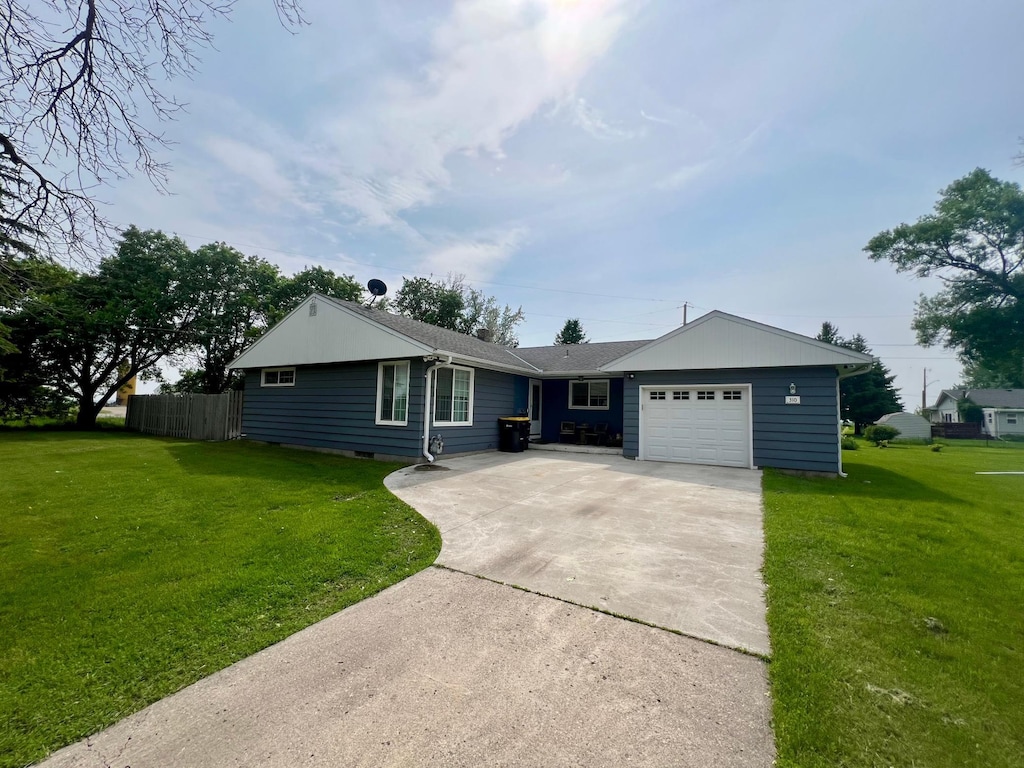 310 6th St W, Hector, MN 55342 - ranch-style house featuring a garage and driveway