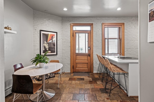 438 Portland Ave Unit 7, Saint Paul, MN 55102 - dining area featuring stone tile floors, a baseboard radiator, and recessed lighting