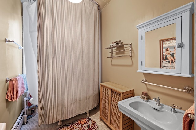 438 Portland Ave Unit 7, Saint Paul, MN 55102 - bathroom with a sink, a baseboard radiator, and a shower with curtain