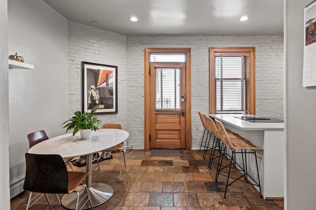 438 Portland Ave Unit 7, Saint Paul, MN 55102 - entrance foyer with stone tile floors, baseboard heating, and recessed lighting