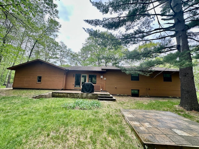 12124 County Road 118, Merrifield, MN 56465 - back of house with a lawn and a wooden deck