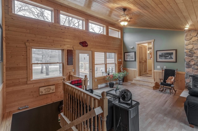 12124 County Road 118, Merrifield, MN 56465 - living room featuring wooden walls, wooden ceiling, wainscoting, high vaulted ceiling, and wood finished floors