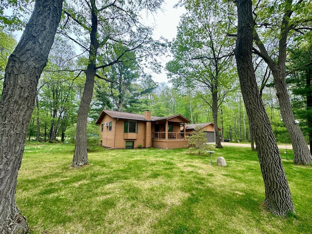 12124 County Road 118, Merrifield, MN 56465 - rear view of property with a chimney and a yard
