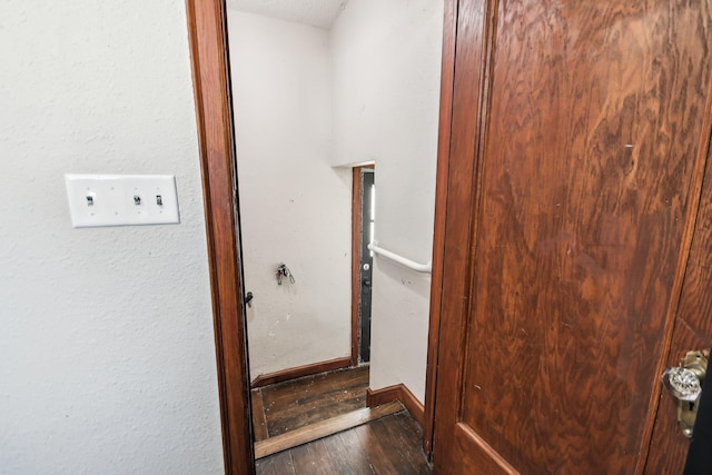 interior space featuring wood finished floors and baseboards