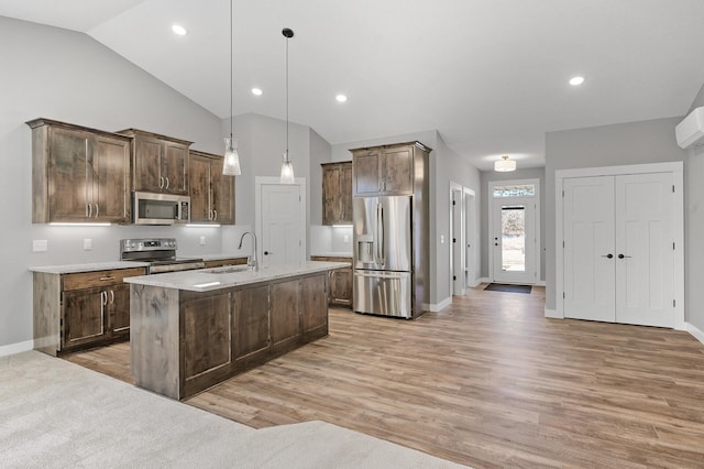 26284 1st St W, Zimmerman, MN 55398 - kitchen featuring a sink, baseboards, appliances with stainless steel finishes, and lofted ceiling
