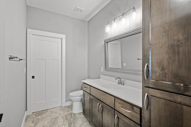 26284 1st St W, Zimmerman, MN 55398 - bathroom featuring vanity, baseboards, toilet, visible vents, and marble finish floor