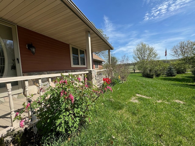 20437 County Highway 65, Henning, MN 56551 - view of grassy yard with a porch