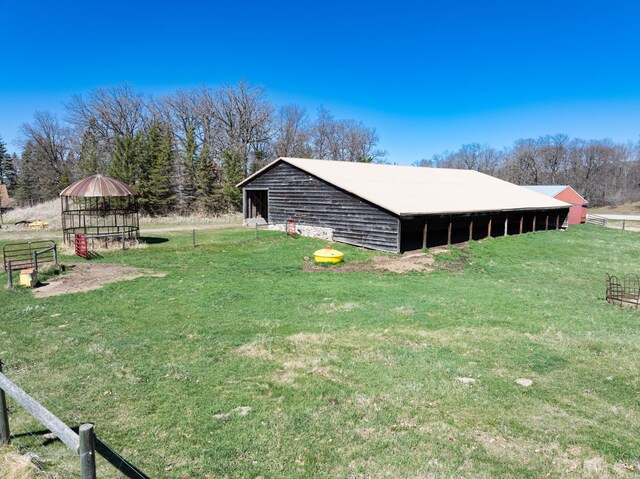 20437 County Highway 65, Henning, MN 56551 - view of pole building featuring a yard