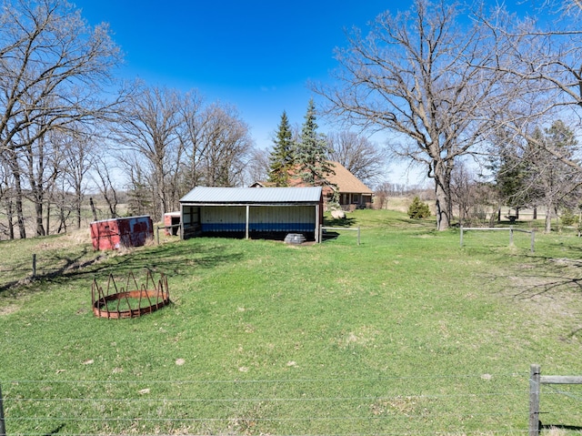 20437 County Highway 65, Henning, MN 56551 - view of grassy yard featuring a pole building and an outdoor structure