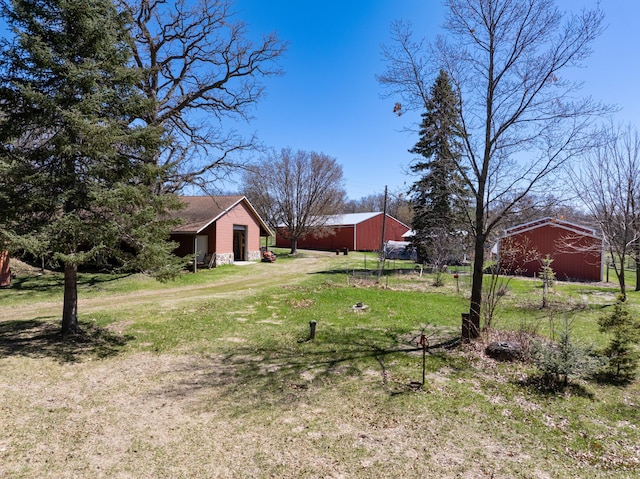 20437 County Highway 65, Henning, MN 56551 - view of green lawn with an outbuilding