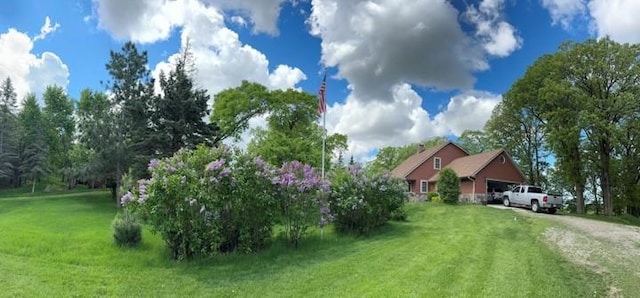 20437 County Highway 65, Henning, MN 56551 - view of green lawn featuring dirt driveway and an attached garage