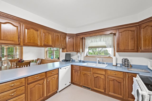 20437 County Highway 65, Henning, MN 56551 - kitchen with white appliances, a sink, and brown cabinets