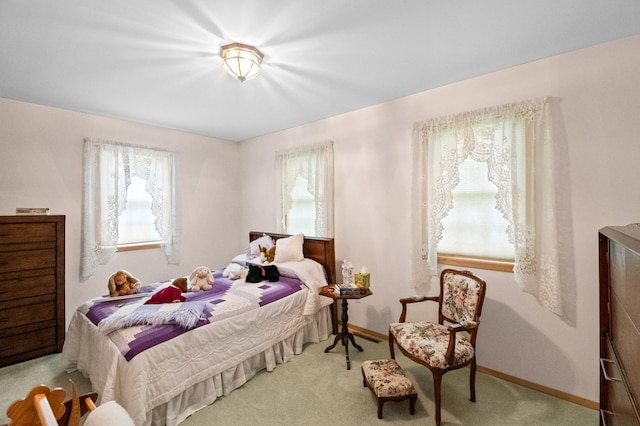 20437 County Highway 65, Henning, MN 56551 - carpeted bedroom featuring multiple windows and baseboards