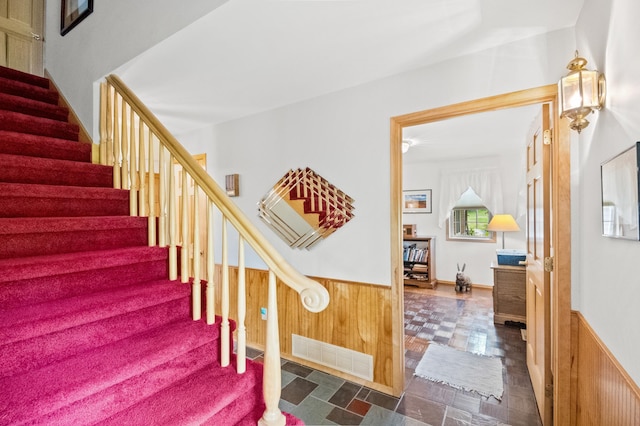 20437 County Highway 65, Henning, MN 56551 - stairs featuring wainscoting and wood walls