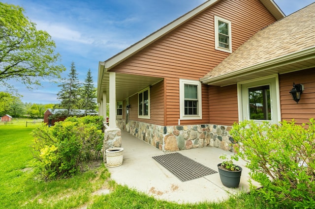 20437 County Highway 65, Henning, MN 56551 - rear view of property with a shingled roof, a yard, and a patio area