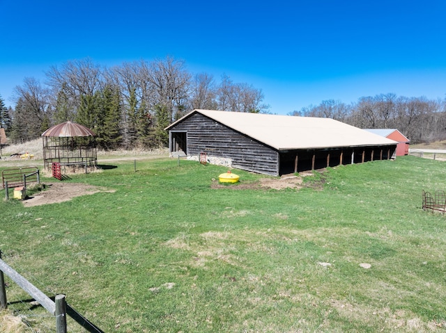 20437 County Highway 65, Henning, MN 56551 - view of pole building featuring a lawn