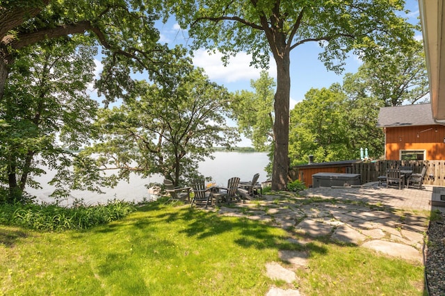 3035 Lakeshore Ave, Medina, MN 55359 - view of yard with a hot tub, a water view, and a patio area